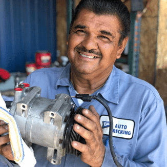 man holding a car part